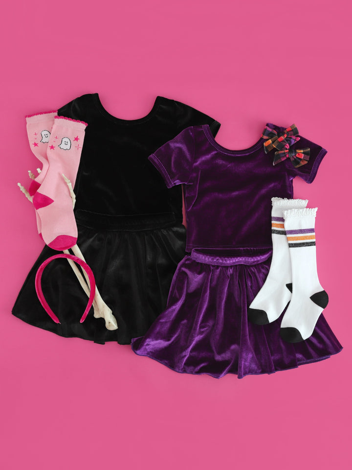 girls' matching Halloween velvet tops and skorts in purple and black with coordinating accessories