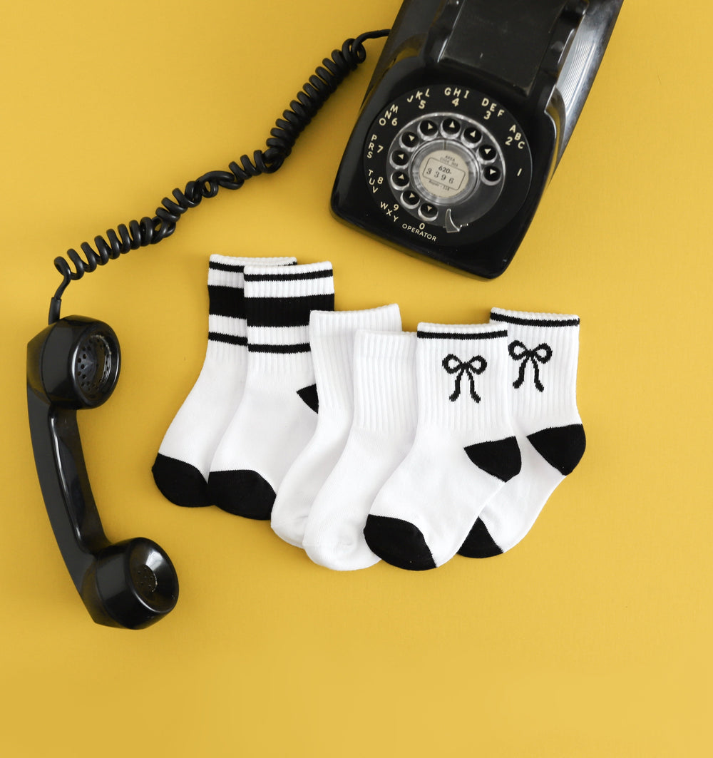 girls black and white crew sock three pack styled with vintage telephone