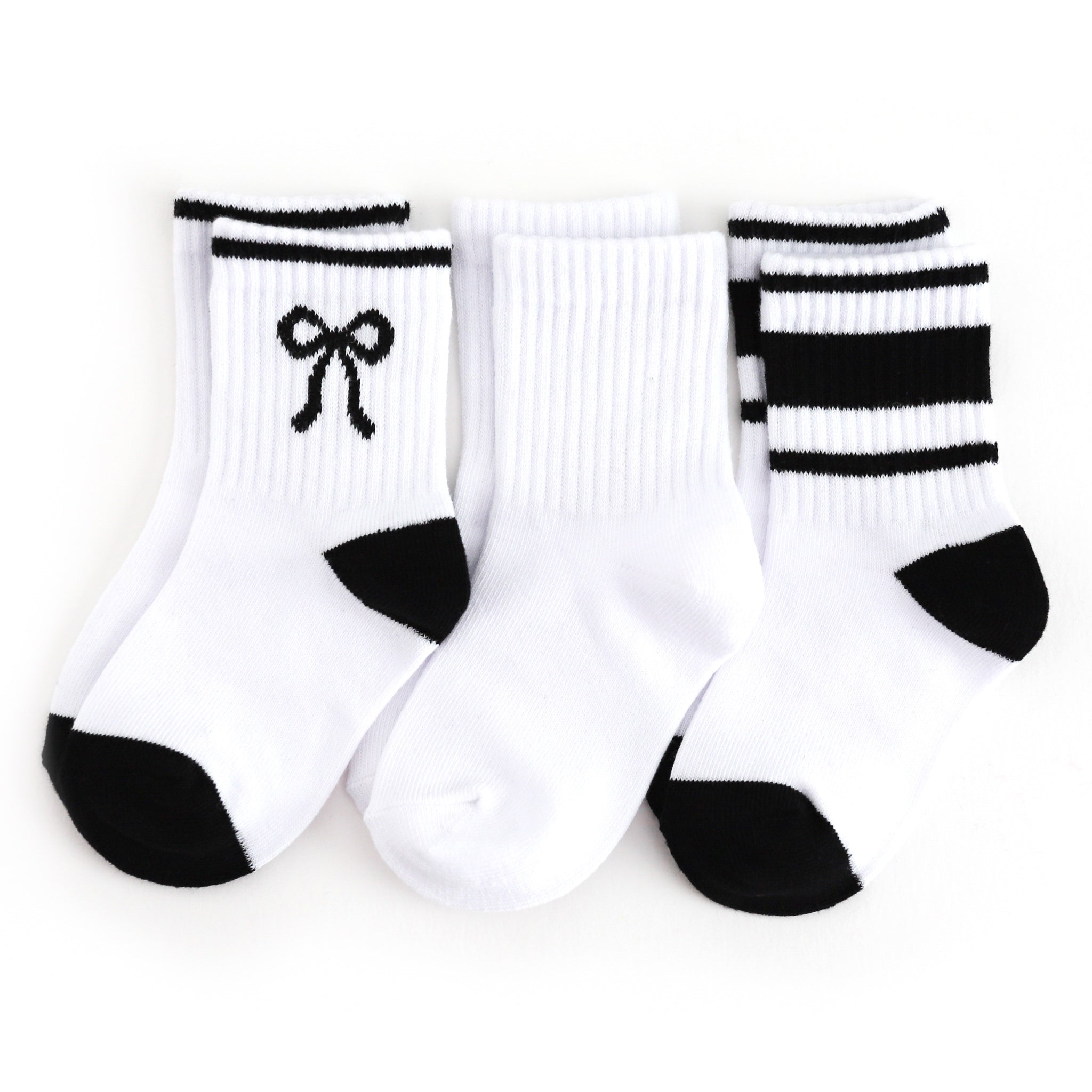 girls three pack of crew socks:  white with black bow, solid white and white with black stripes