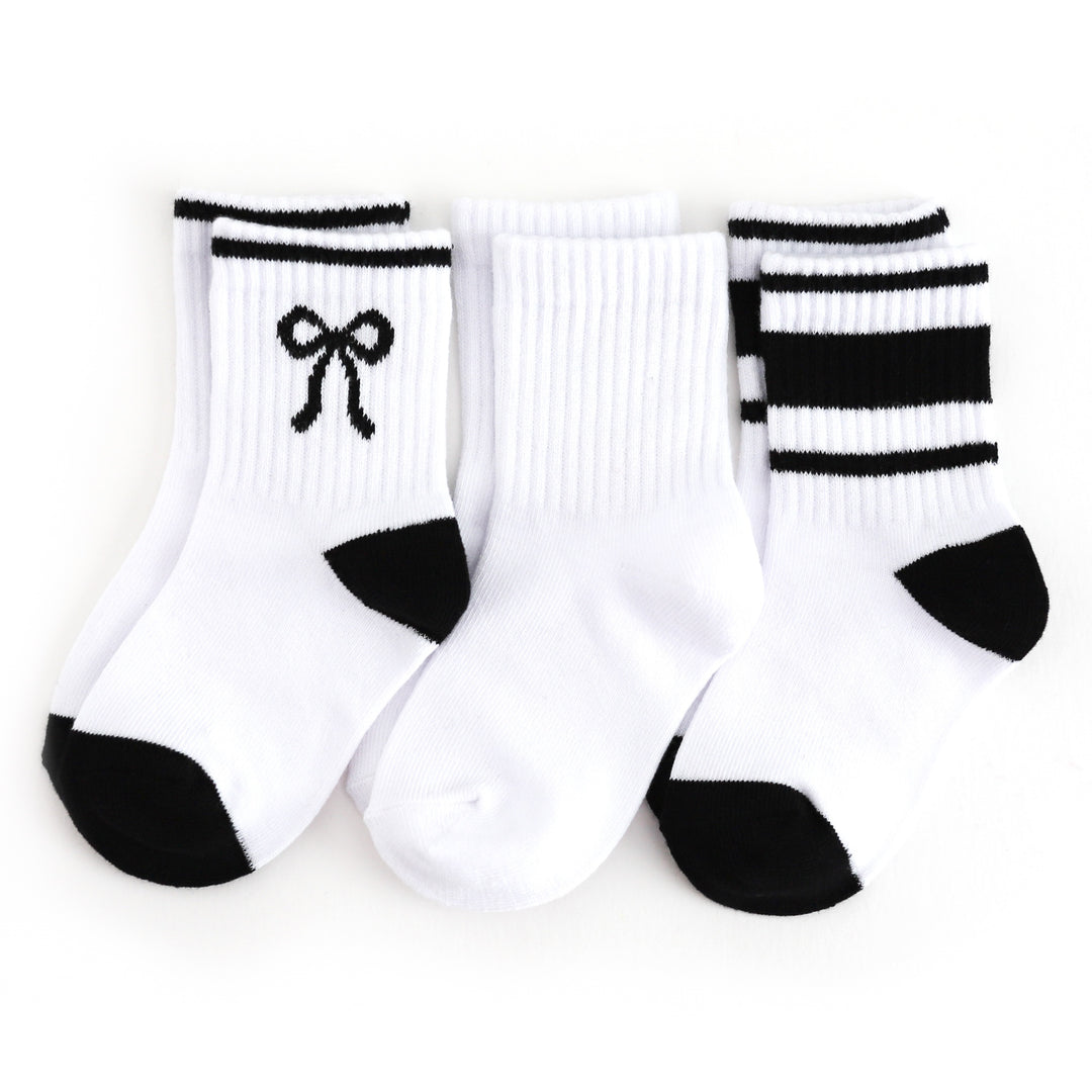 girls three pack of crew socks:  white with black bow, solid white and white with black stripes
