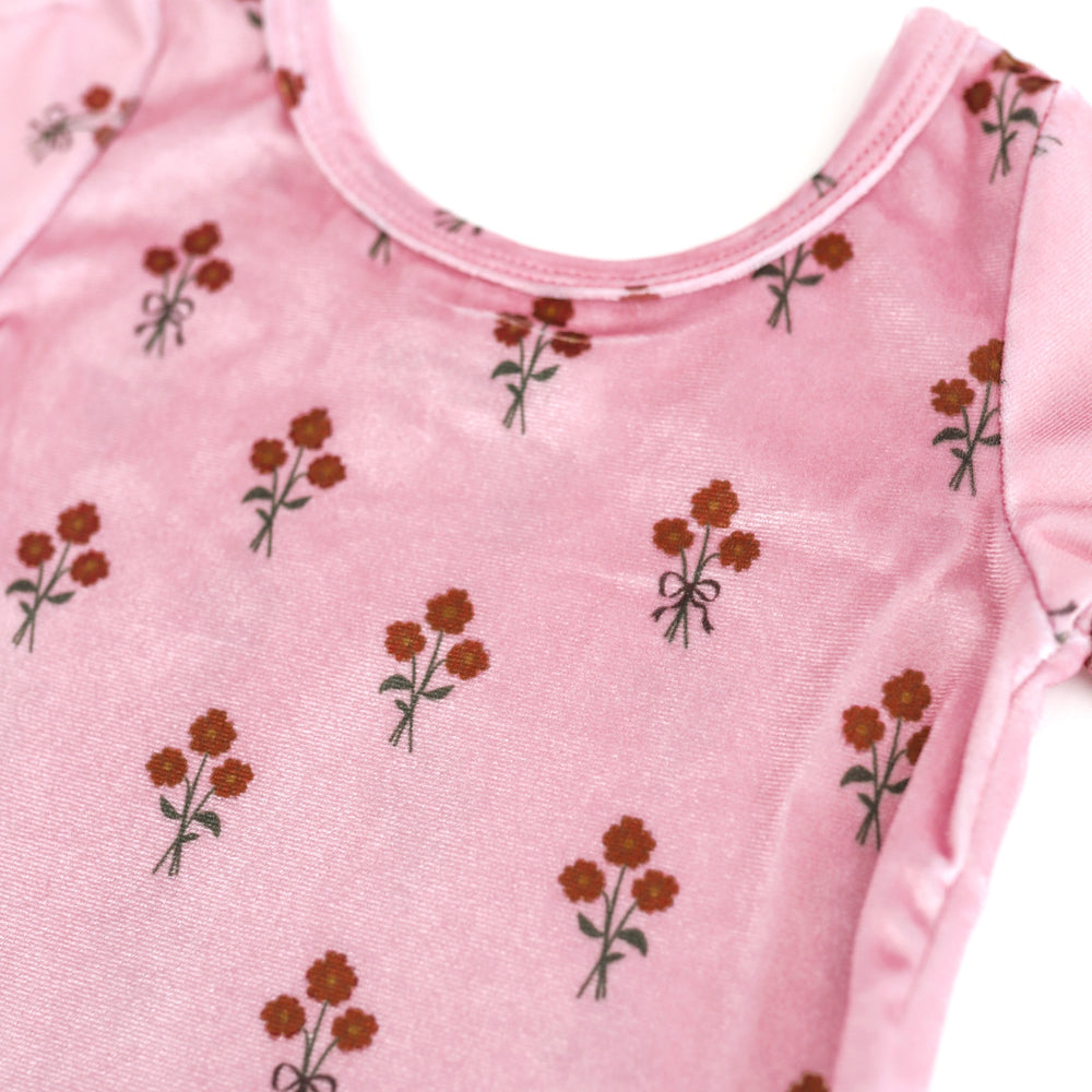 closeup of girls' pink velvet top with fall floral print