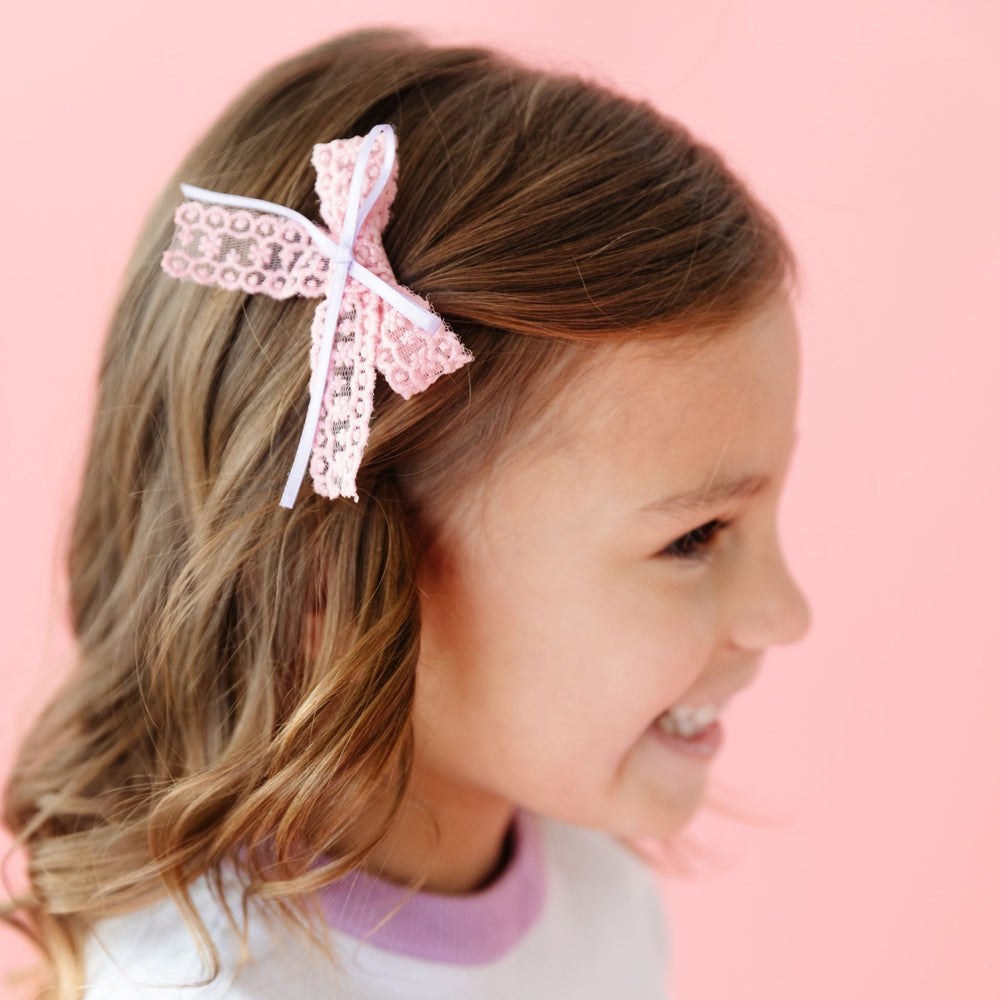 little girls pink lace and lavender ribbon pigtail bow for Valentine's Day