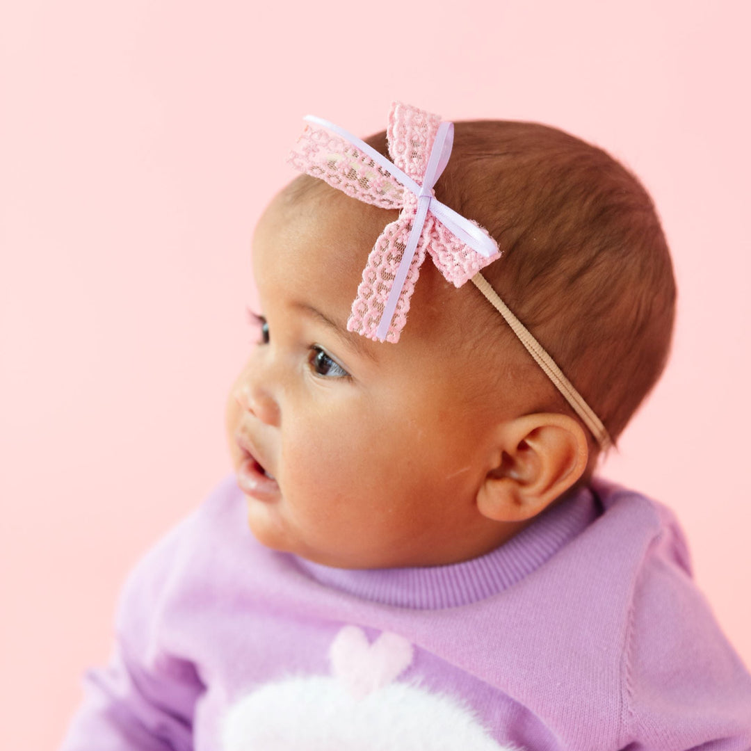 baby girl in pink lace and lavender ribbon bow on nylon headband with matching valentine's day cupcake sweater