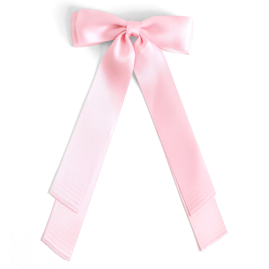 light pink long tailed satin double bow on clip to match Valentine's Day outfits