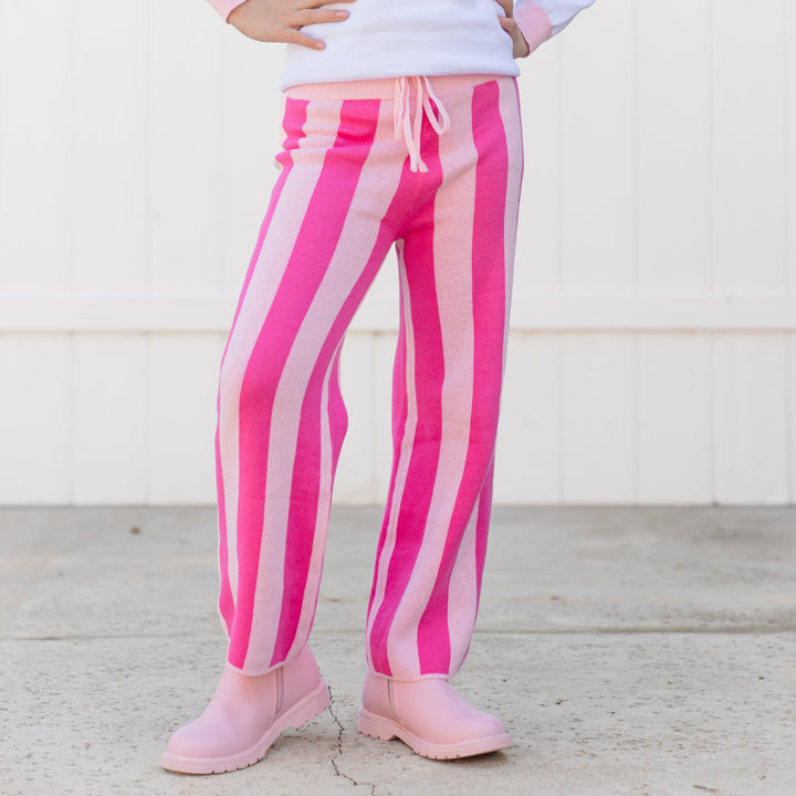 closeup of girl in two tone pink stripe cotton knit sweater pants with adjustable drawstring waistband