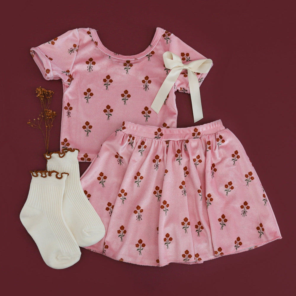 girls' pink velvet short sleeve top and matching skort with petite fall floral pattern paired with ivory lettuce trim midi socks and satin hair bow