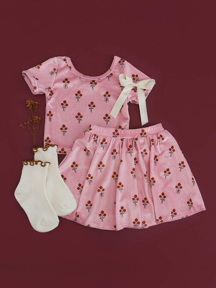 girls' pink velvet short sleeve top and matching skort with petite fall floral pattern paired with ivory lettuce trim midi socks and satin hair bow