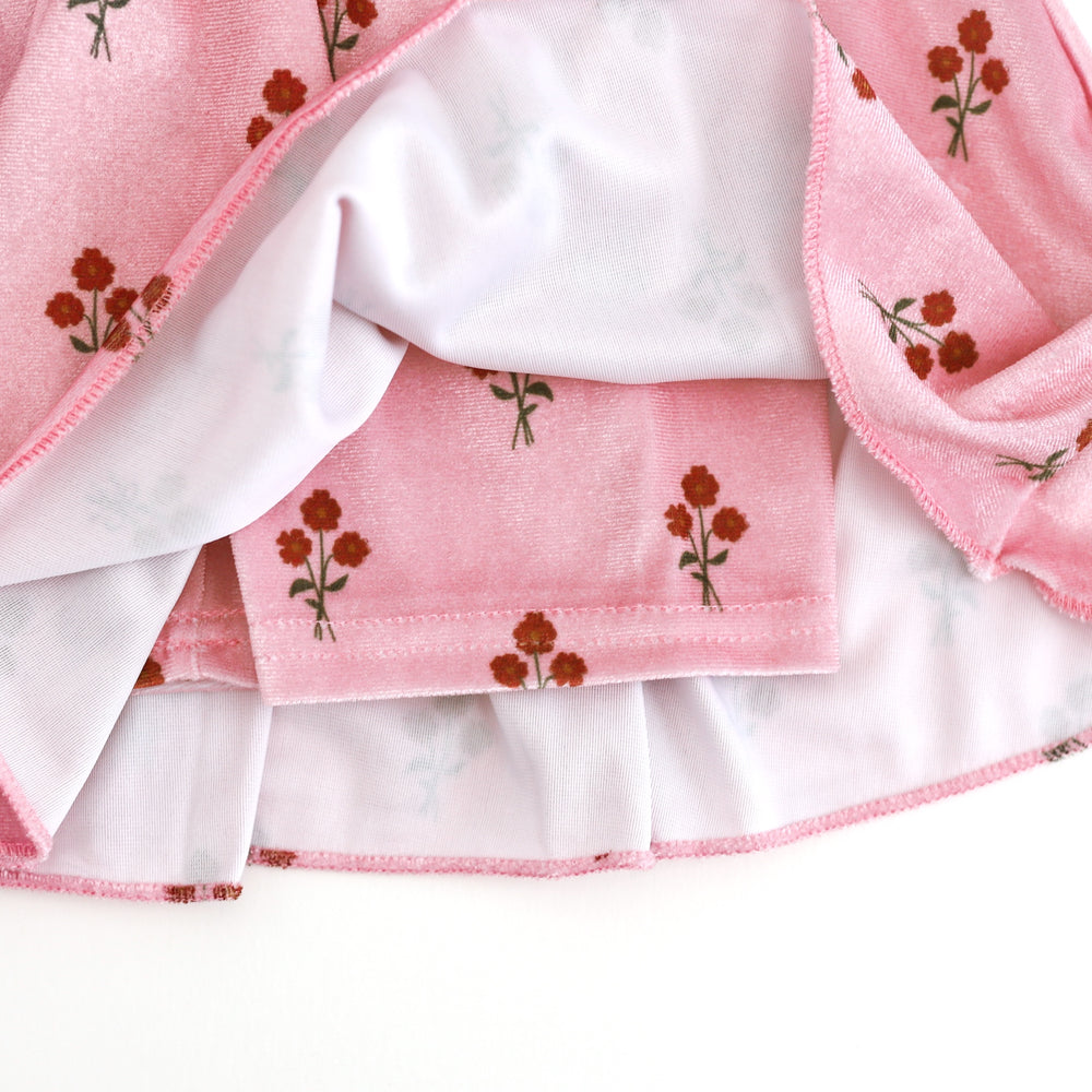 closeup of attached velvet shorts for girls' light pink fall floral velvet skort 