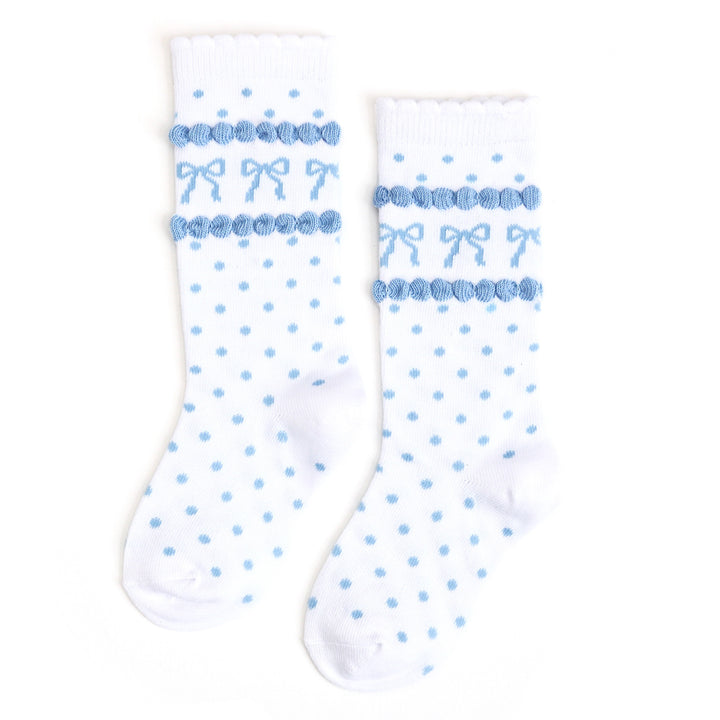 girl's white scalloped knee highs with blue polka dots and blue blow design 