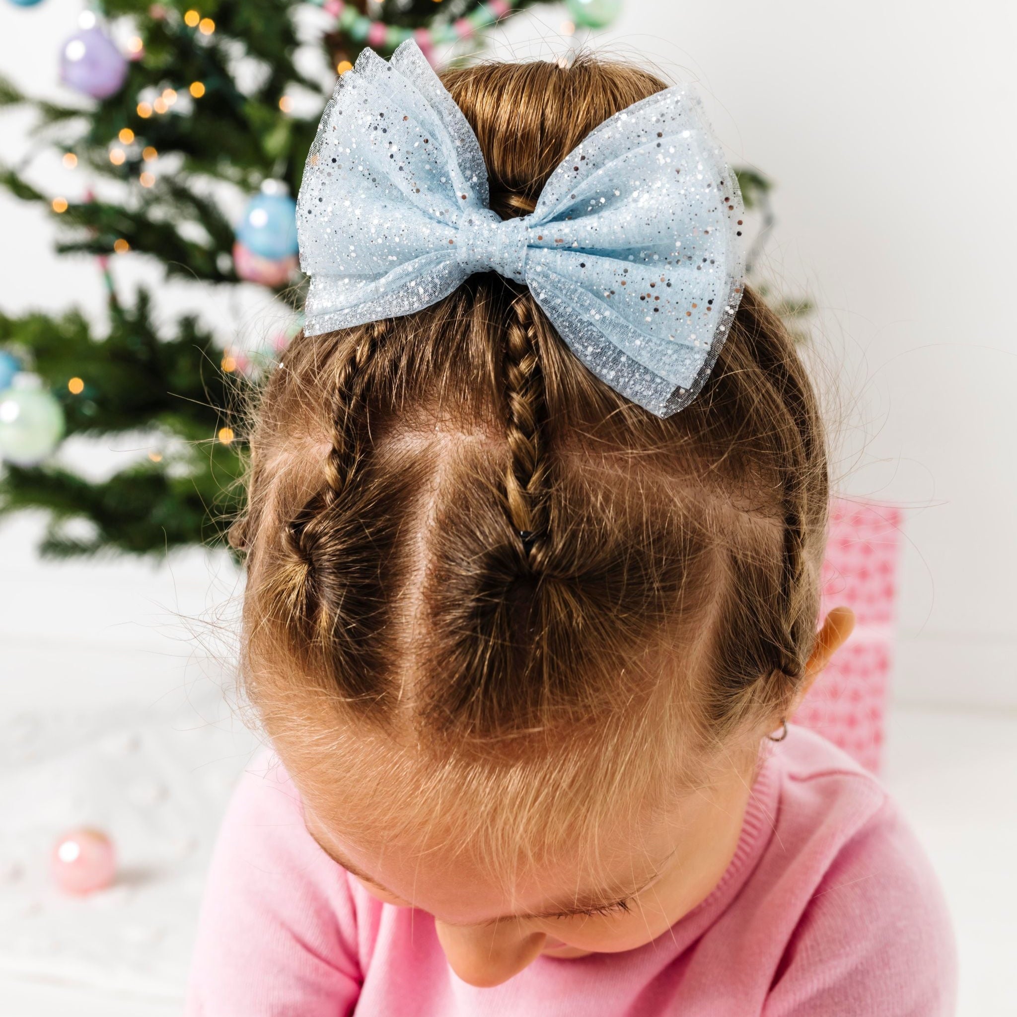 little girl in blue sparkly tutu bow paired with winter wonderland Christmas outfit