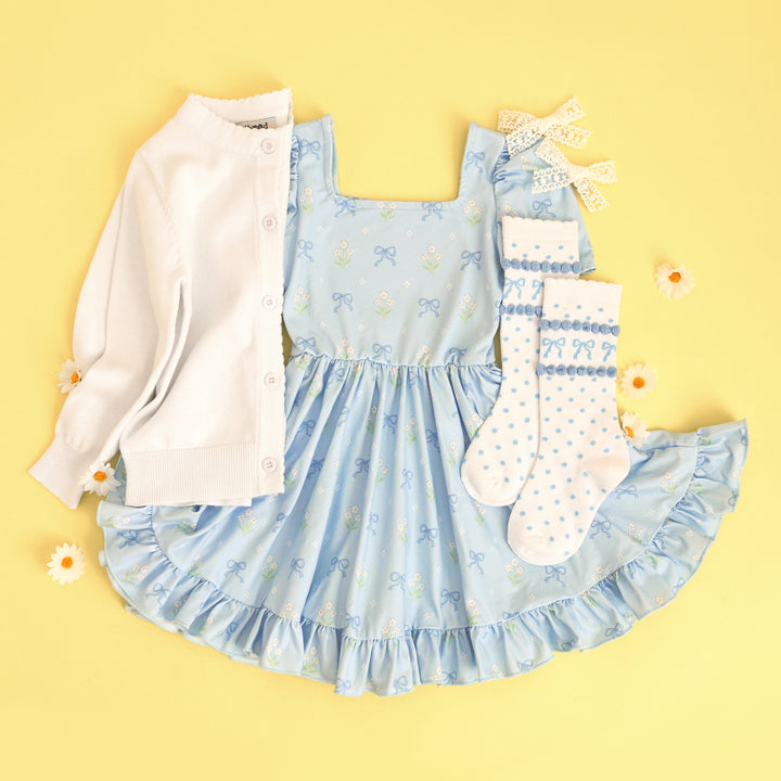 girl's blue floral square neck dress with matching white accessories and knee highs with blue bow print