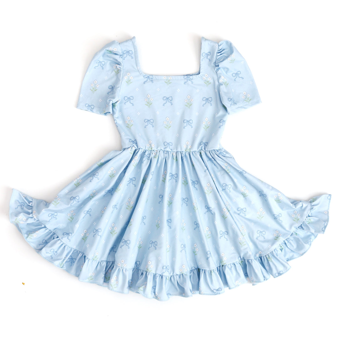 little girl's spring square neck twirl dress in blue with flower and bow print