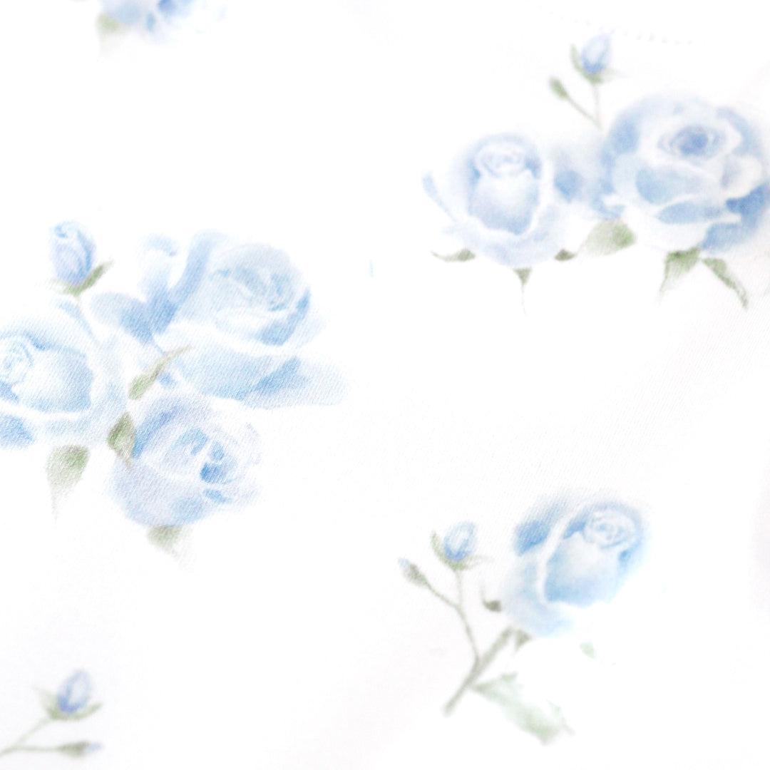 girls' spring print closeup of dreamy pastel blue roses in bloom on white background