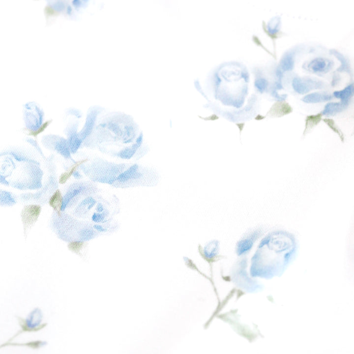 girls' spring print closeup of dreamy pastel blue roses in bloom on white background