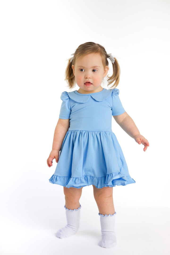 little girl in spring blue cotton blend twirl dress with peter pan collar and matching white ribbed midi socks with blue trim