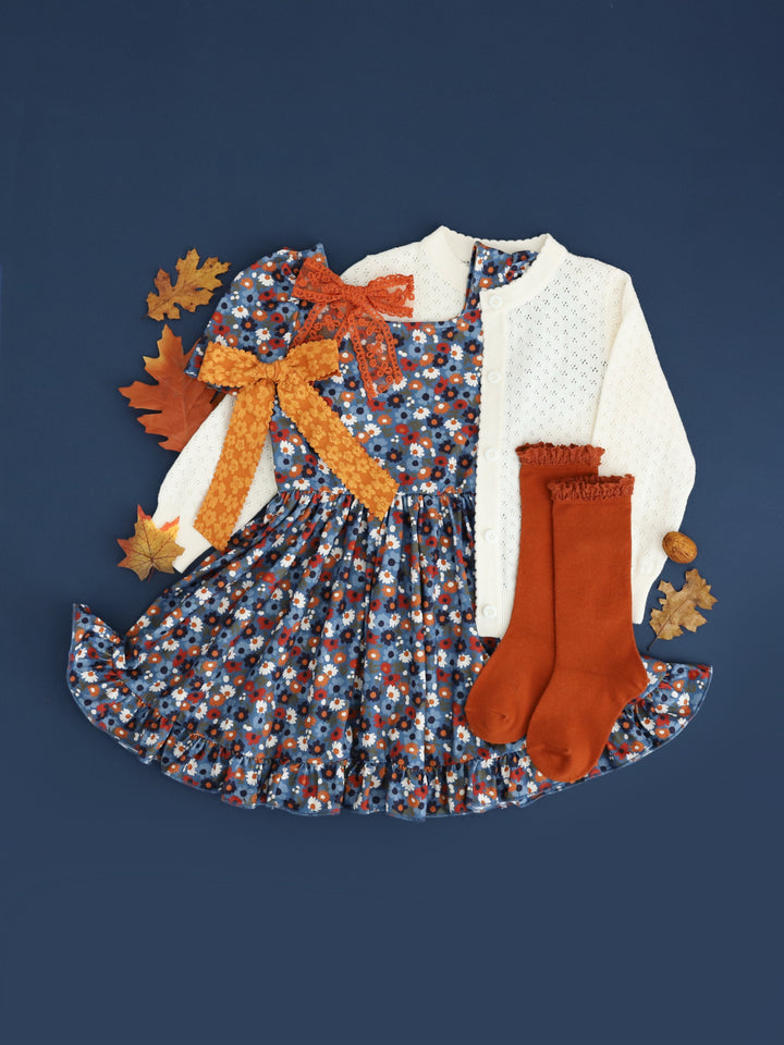 girls blue fall floral twirl dress paired with ivory pointelle cotton knit cardigan and matching rust and olive accessories
