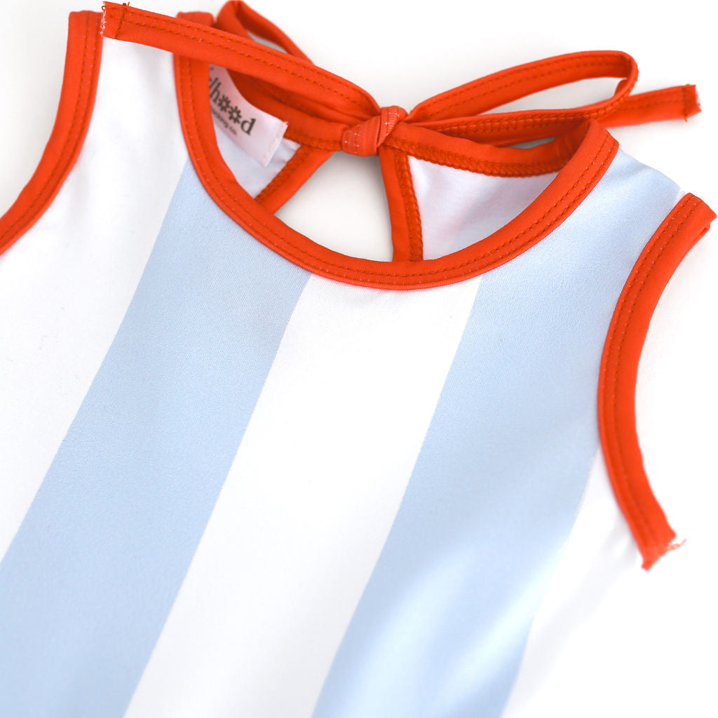 closeup of blue and white wide stripe print sleeveless twirl with bright orange trim