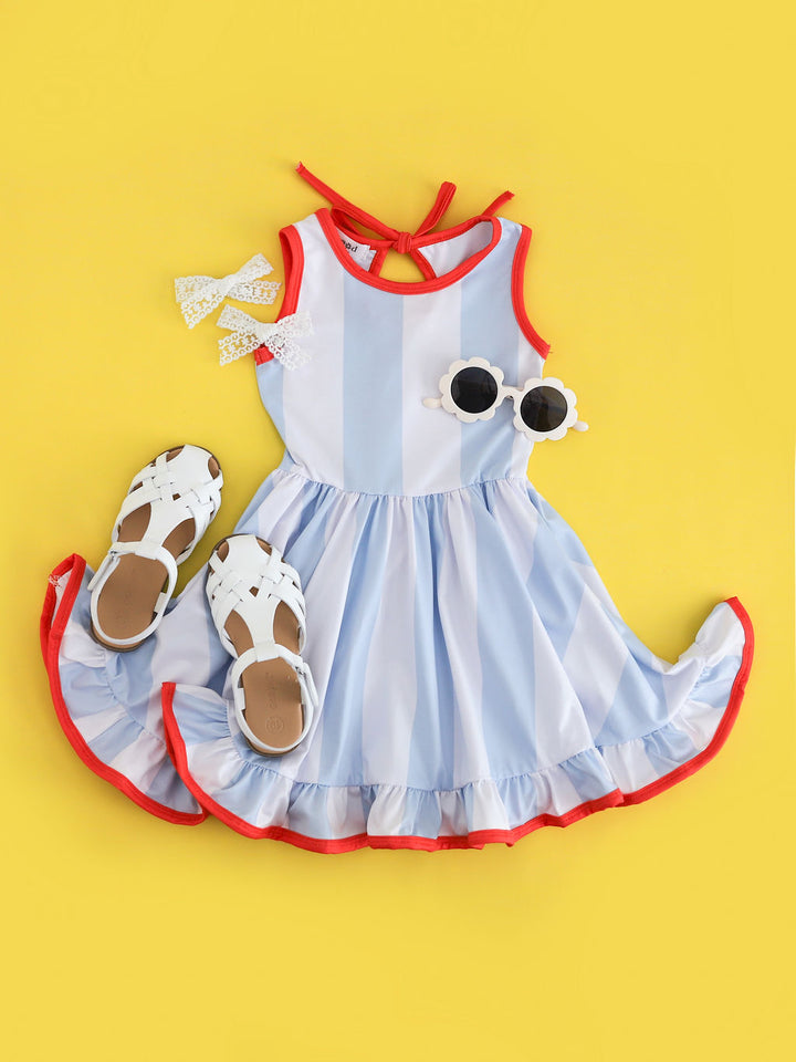 girls summer twirl dress with blue and white wide stripes and orange trim paired with white accesories