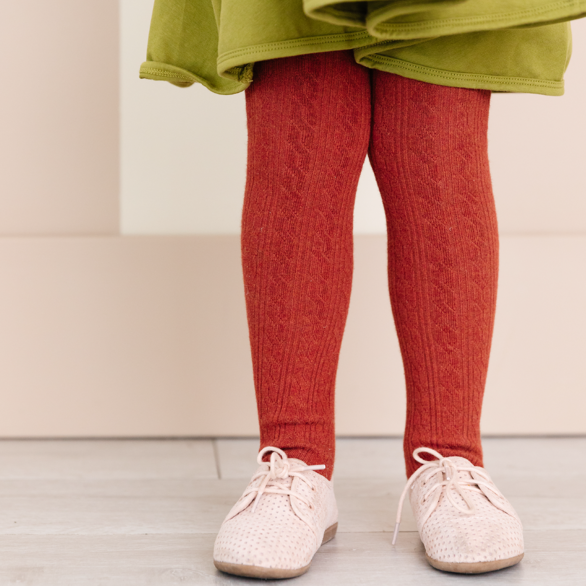 Brick red cable knit tights made by little stocking co