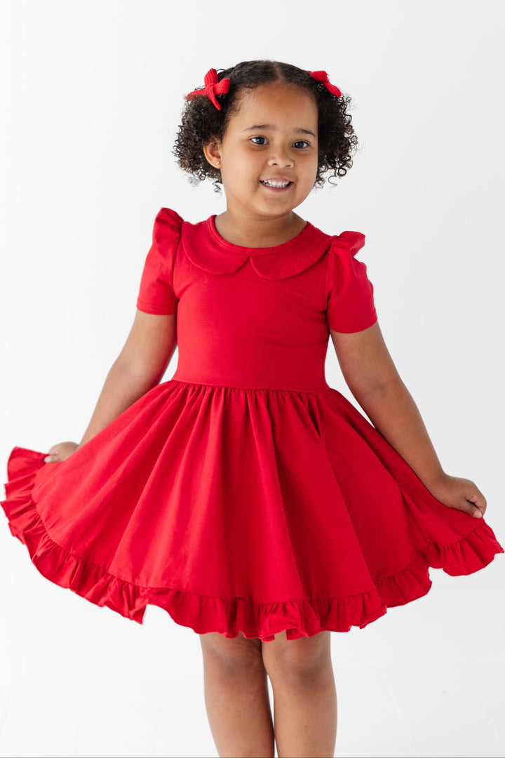 little girl in bright red cotton blend twirl dress with short puffed sleeves, ruffle hem and collar for back to school and christmas