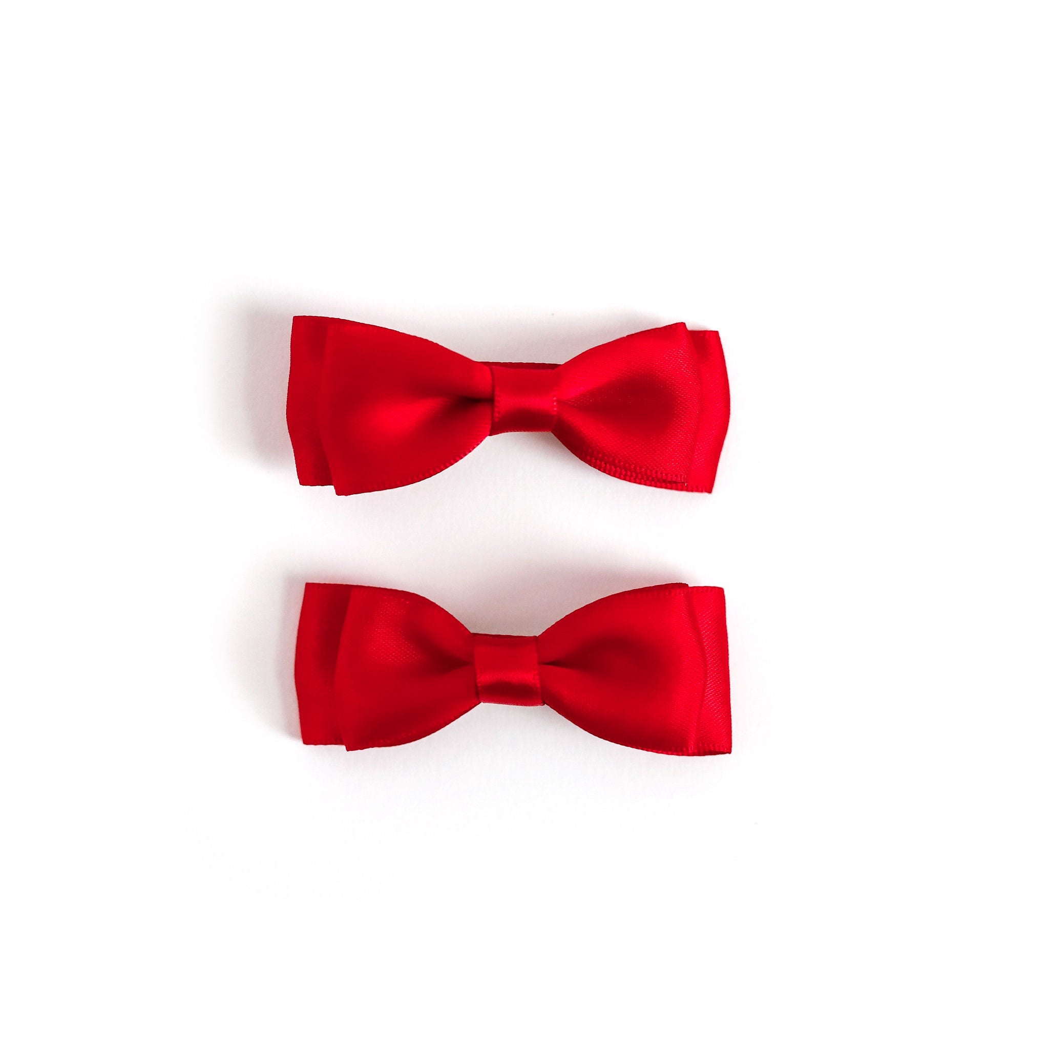 girls bright red satin ribbon bows on pigtail clips