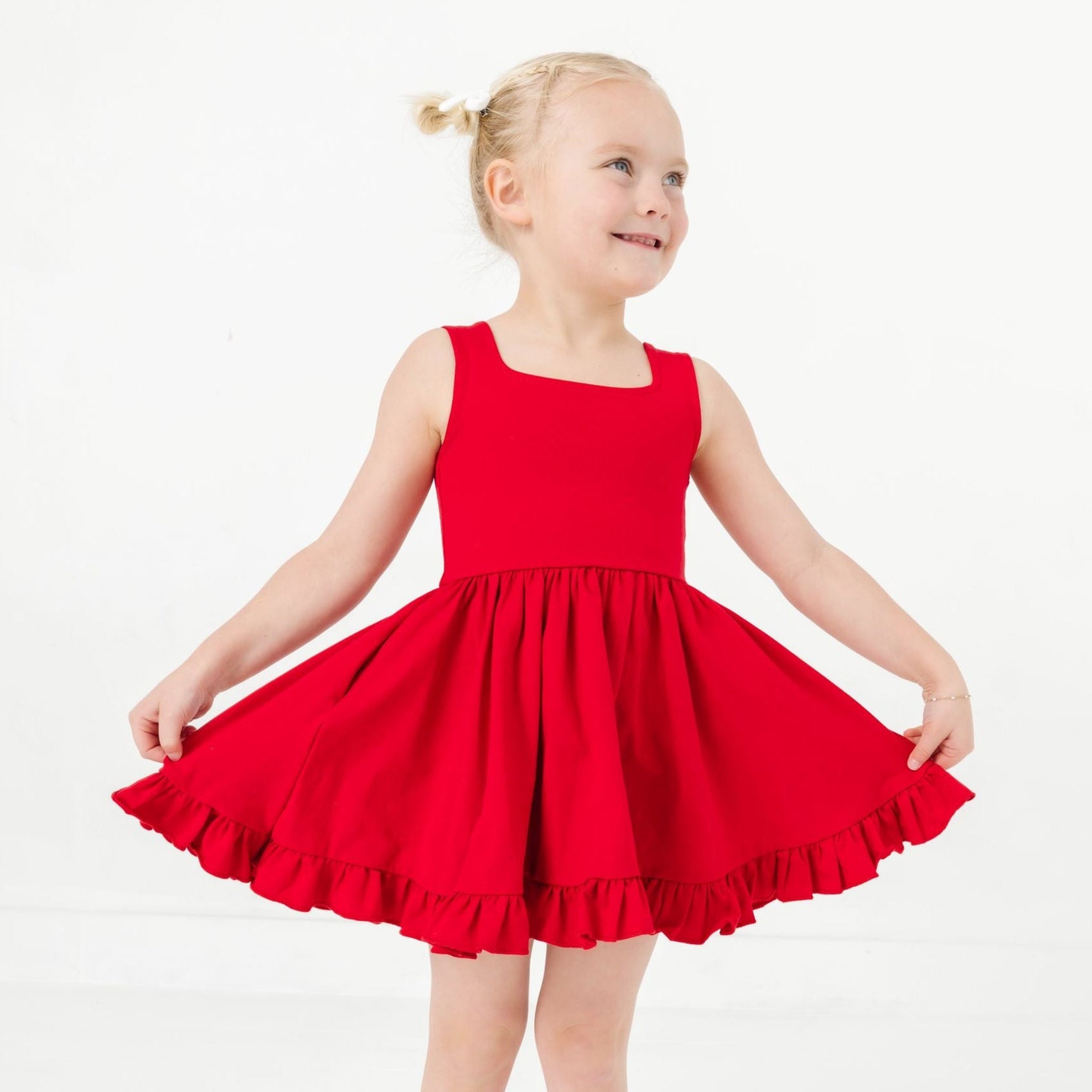 little girl in bright red tank style summer twirl dress 