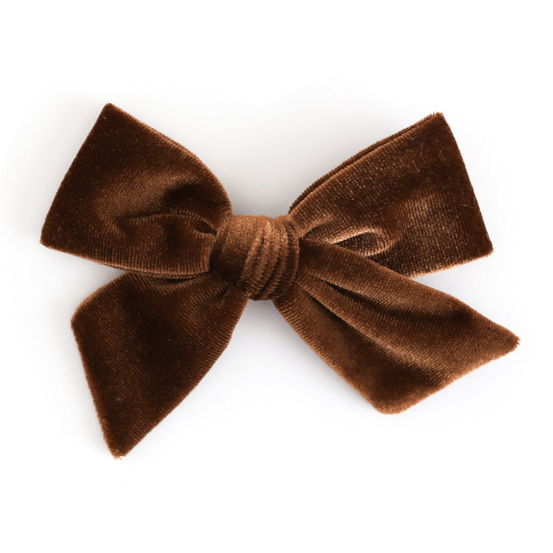 A brown velvet hair bow clip shown against a plain white background.