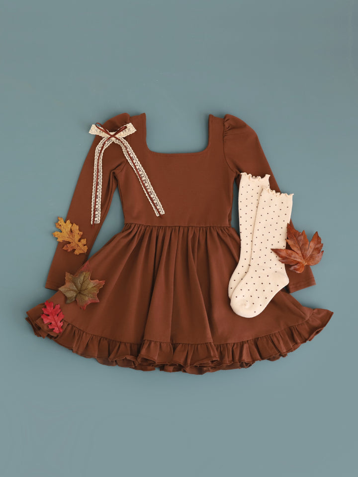 girls rich brown long sleeve cotton blend twirl dress paired with cream dotted knee socks and matching cream and brown lace ribbon hair bow