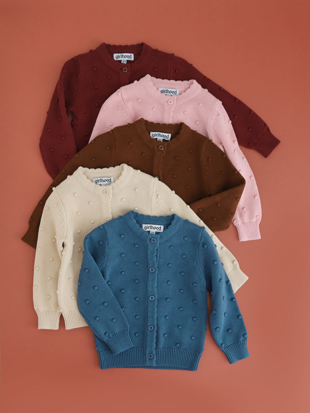 girls cotton knit cardigans with 3D bubble design and button front in blue, cream, brown, pink and burgundy to match fall collection