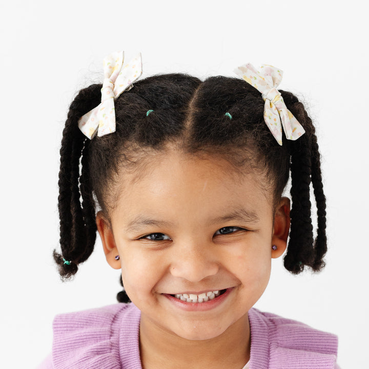 girl with easter animal pigtail bows
