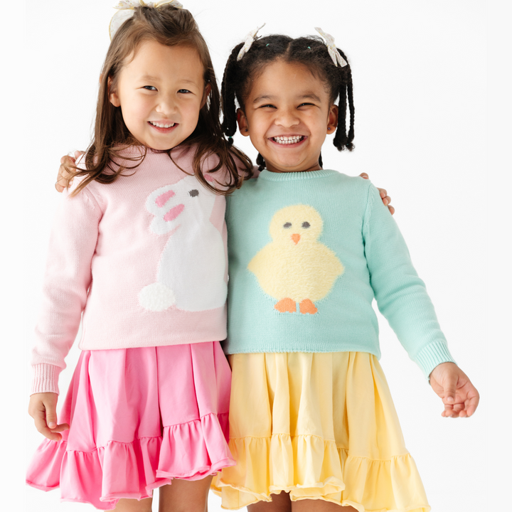 little girls in adorable bunny and chick easter sweaters