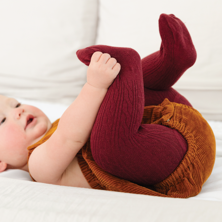 burgundy red cable knit tights on baby