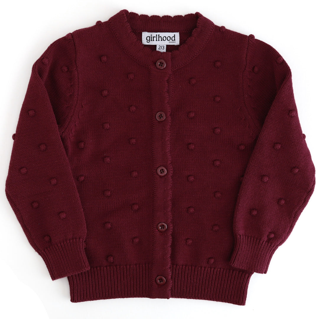 girls burgundy cotton knit cardigan with raised bubble texture, button front and scalloped placket on white background