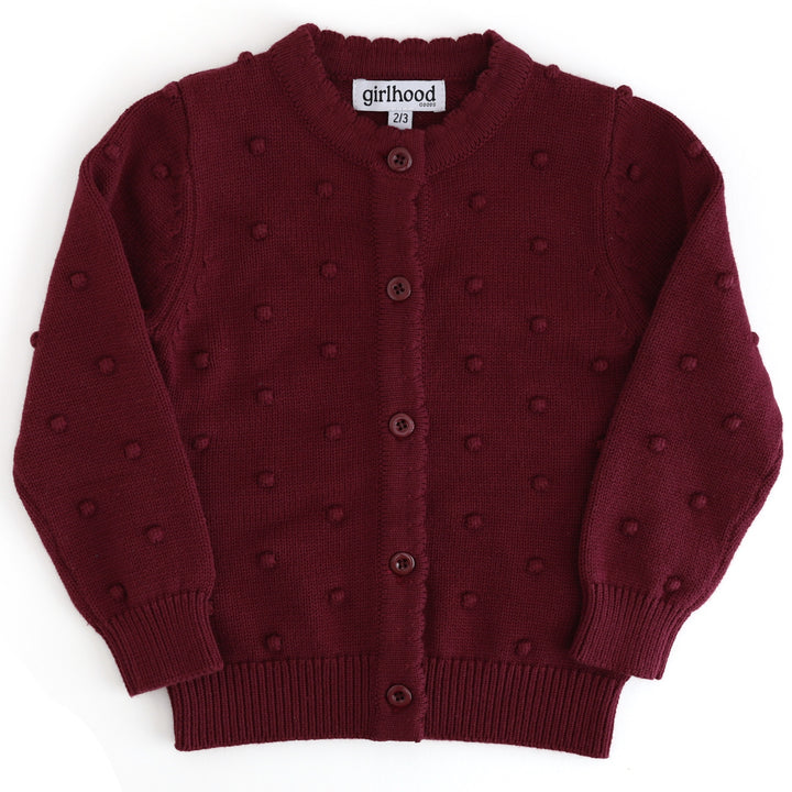 girls burgundy cotton knit cardigan with raised bubble texture, button front and scalloped placket on white background