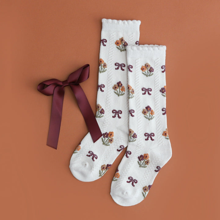 girls' burgundy satin bow on clip and matching cream scallop trimmed knee high socks with fall flower bouquet and bow design