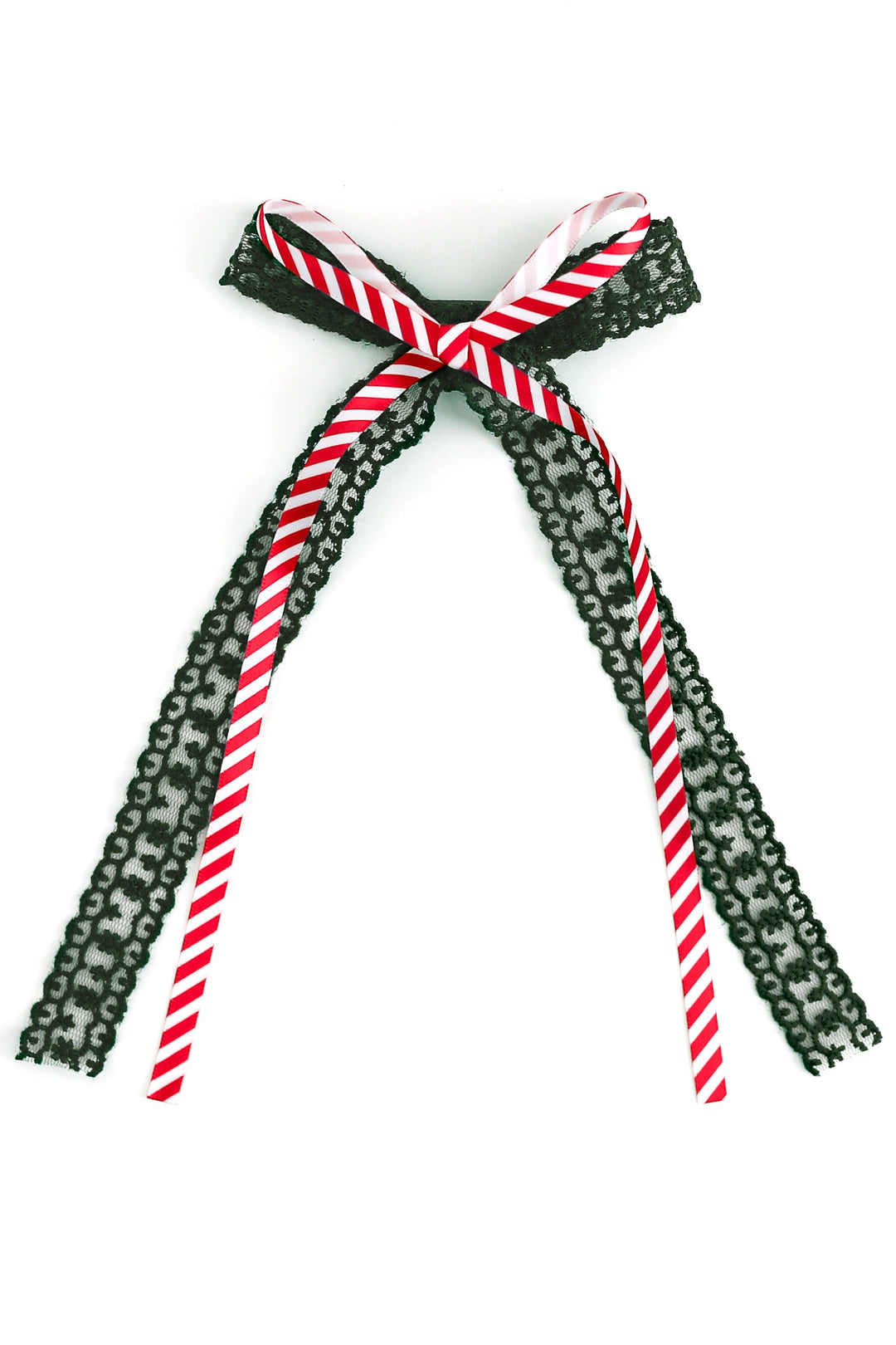 christmas hair bow with dark green lace and printed candy cane stripe ribbon on top shown on white background