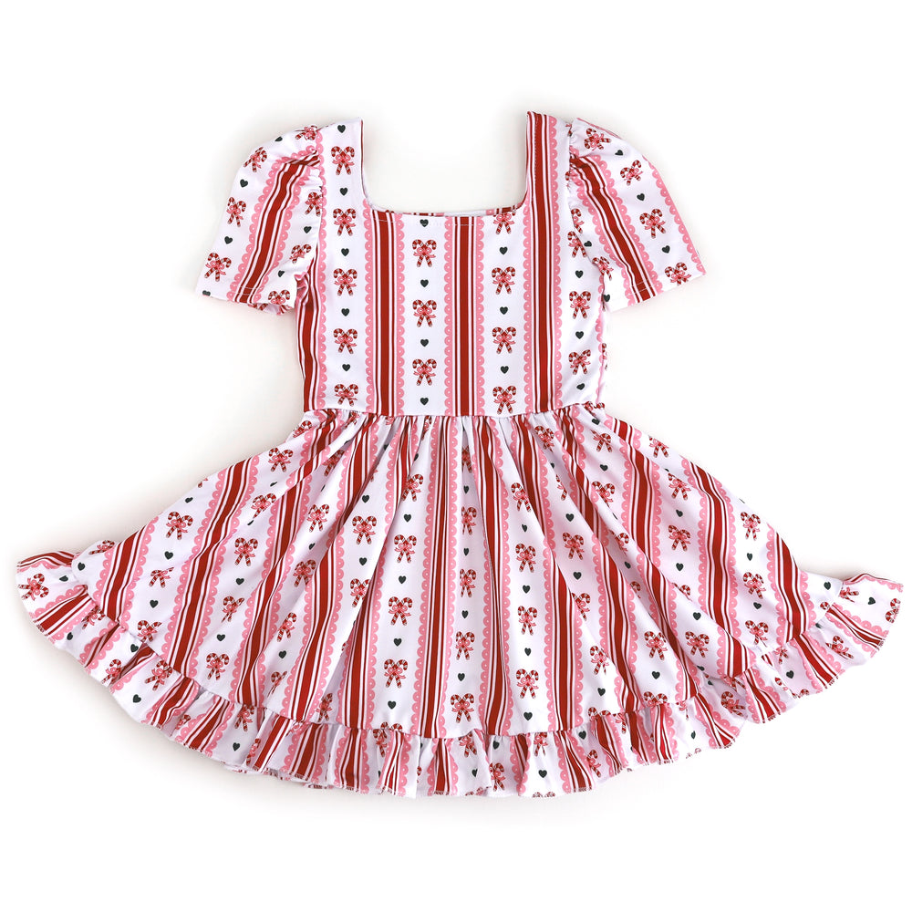 girls square neck short sleeve twirl dress with white base and red and pink candy cane print