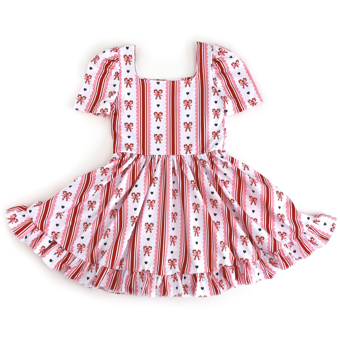 girls square neck short sleeve twirl dress with white base and red and pink candy cane print