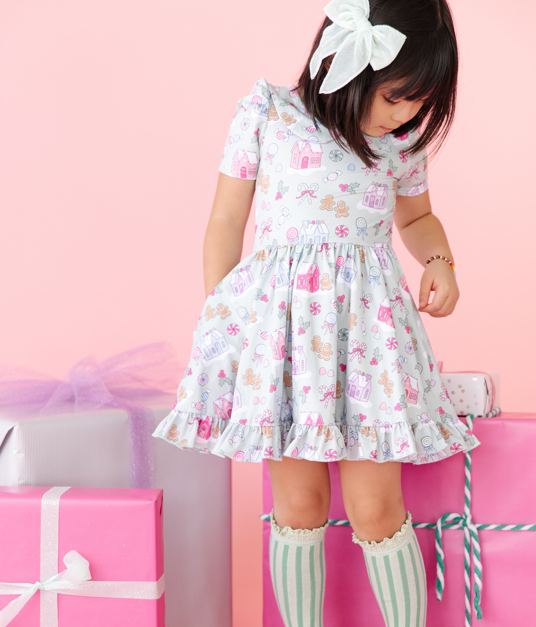 pastel gingerbread christmas dress for little girls with matching mint green stripe knee high socks