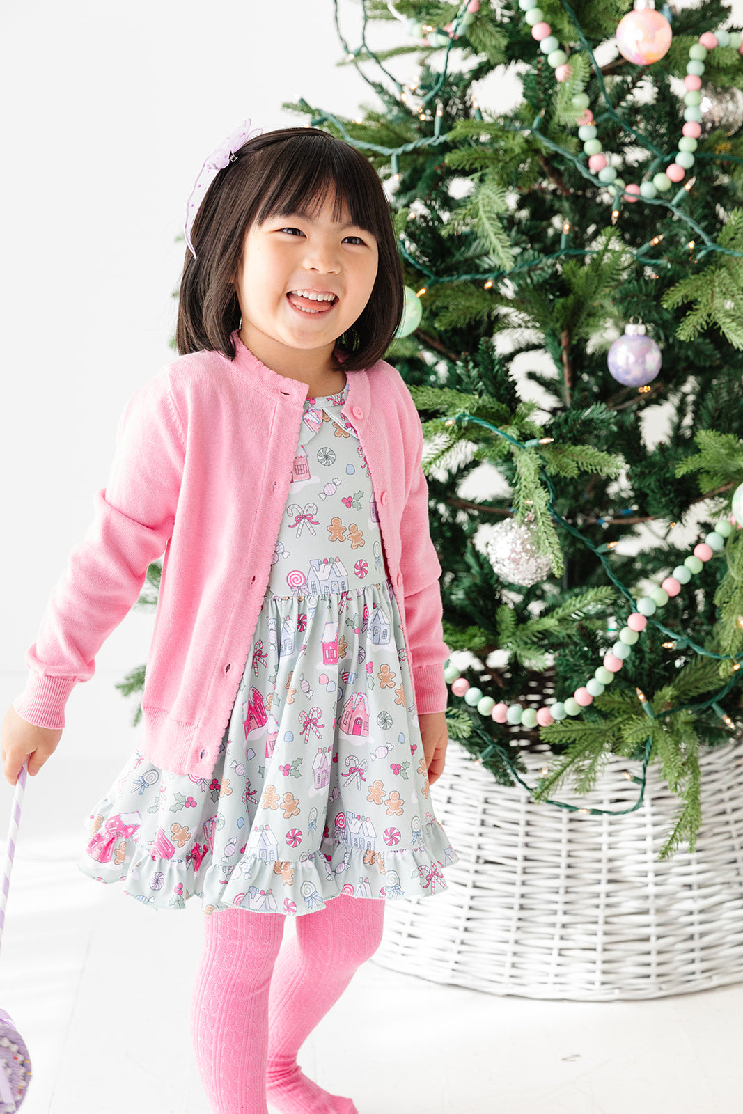 mint candyland dress with matching pink sweater for pastel christmas outfit