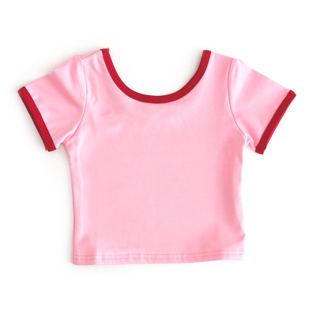 girls fitted cotton blend tee in pink with red binding for summer