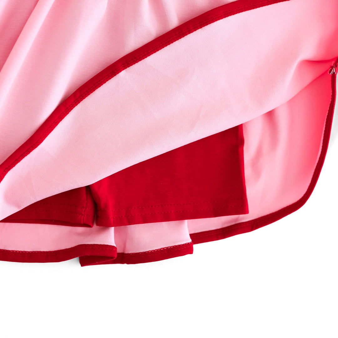 closeup of red built in biker shorts attached to pink summer skort