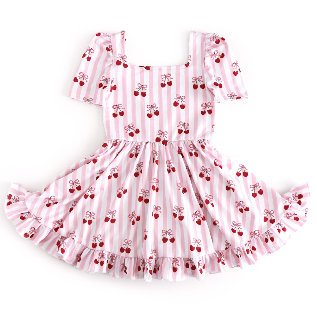 girls' short sleeve, square neck twirl dress with pink and white vertical stripes and cherries tied with bows 