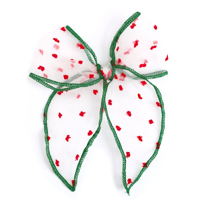 girls sheer Christmas bow with red polka dots and green trim on clip