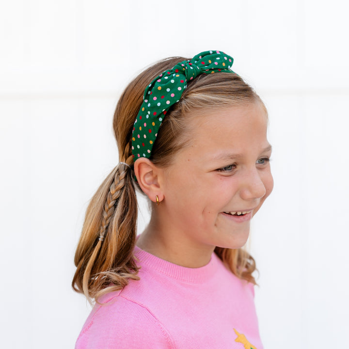 girls green Christmas headband with multicolor festive polka dots