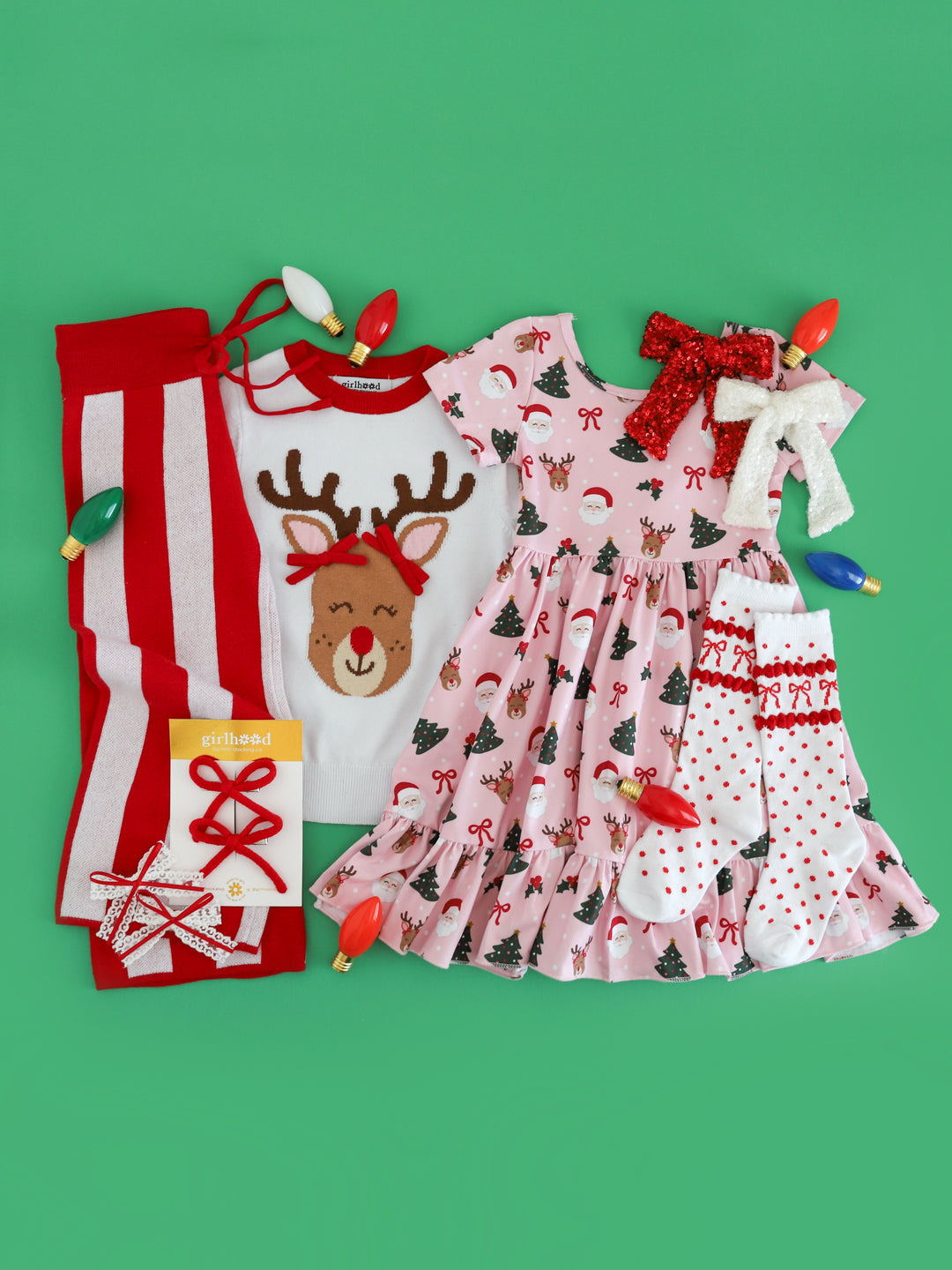 girls' Rudolph inspired Christmas mix and match with white Rudolph sweater, matching Santa and Rudolph print twirl dress and red and white sweater pants