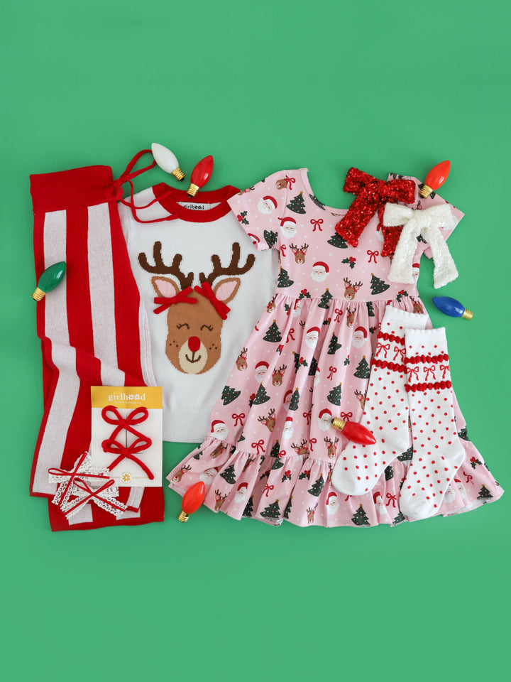 girls' Rudolph inspired Christmas mix and match with white Rudolph sweater, matching Santa and Rudolph print twirl dress and red and white sweater pants