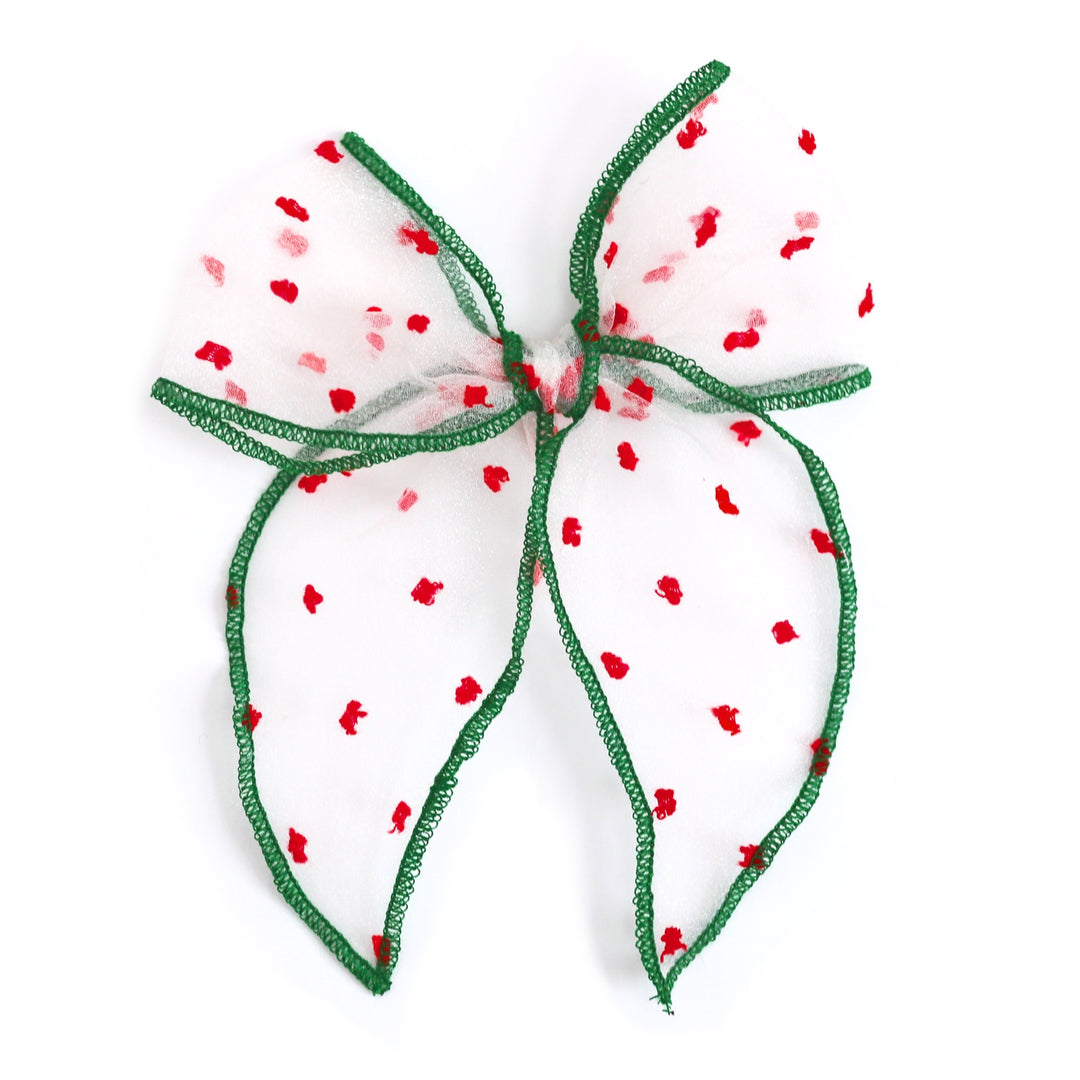 girls' party bow in sheer white with red dots and green trim for classic Christmas outfits