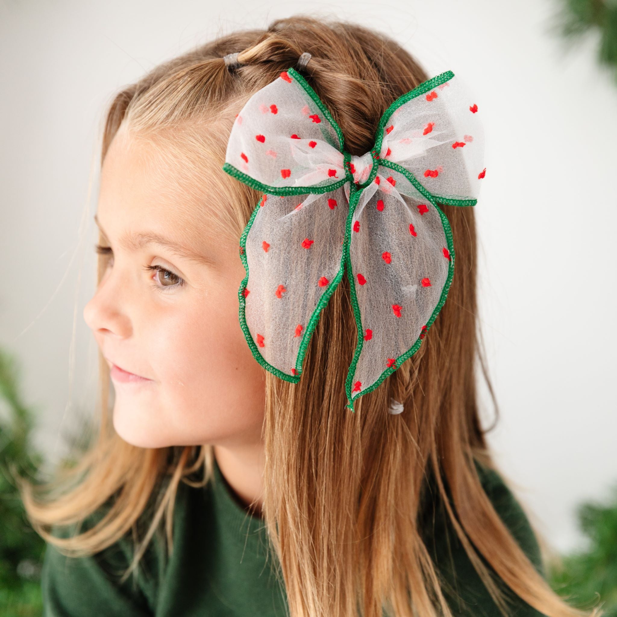 girls sheer Christmas hair bow with red dots and green trim