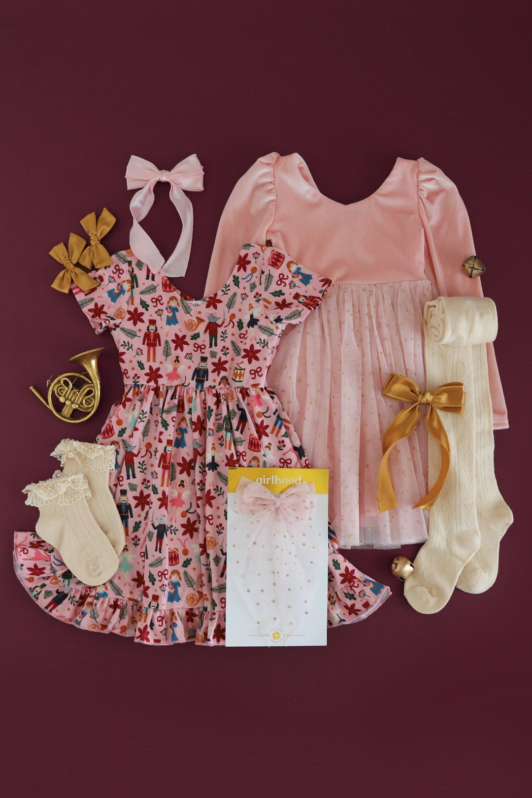 coordinated Nutcracker themed outfits for little girls with nutcracker print dress, satin bows, tulle and more